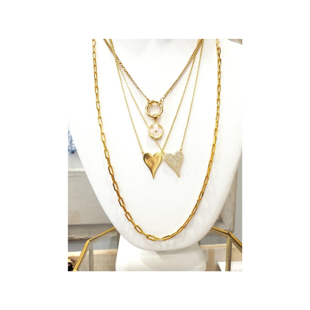 multiple gold chain necklaces.