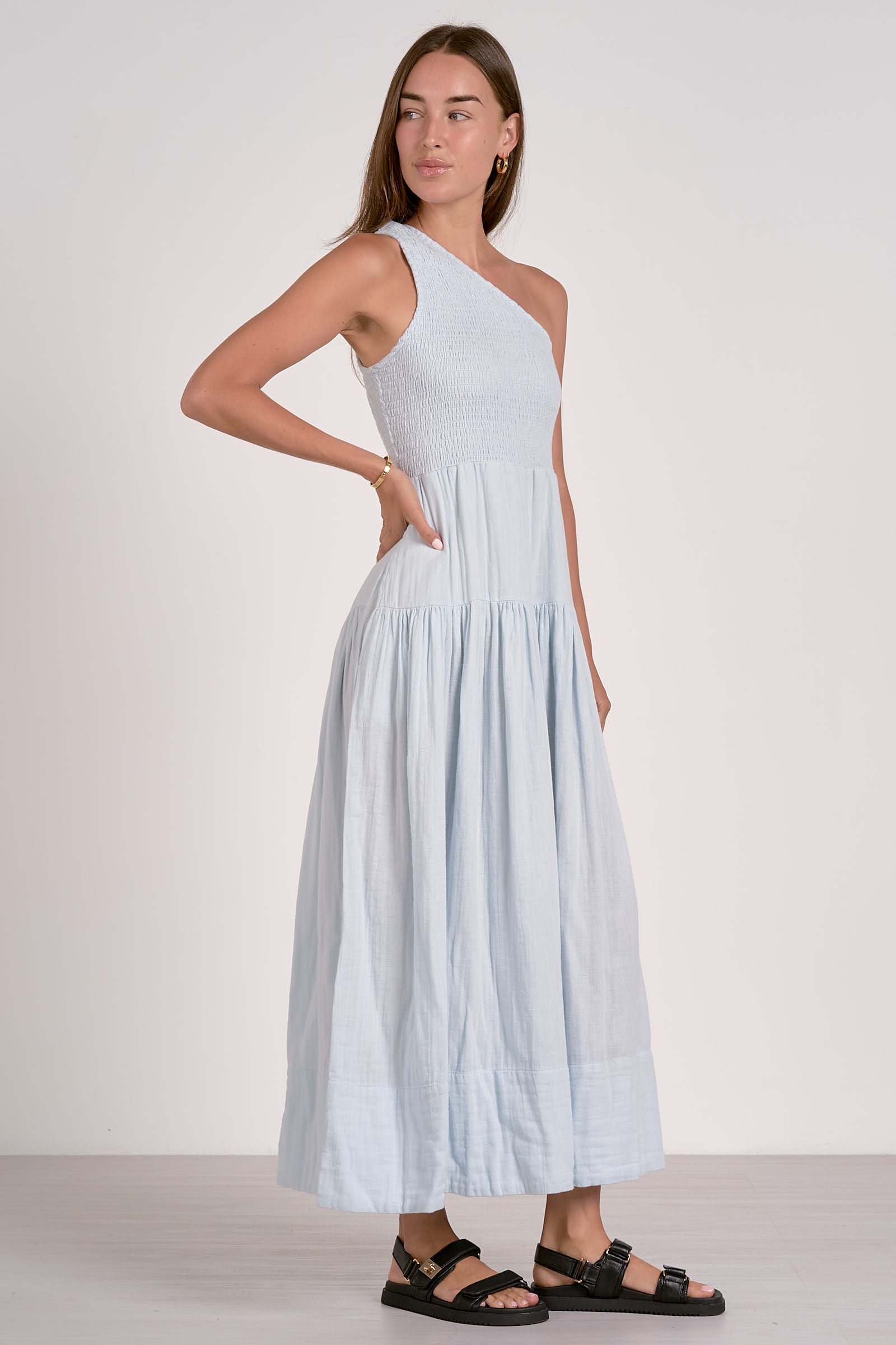 Model wearing a light blue off 1 shoulder cotton  maxi dress