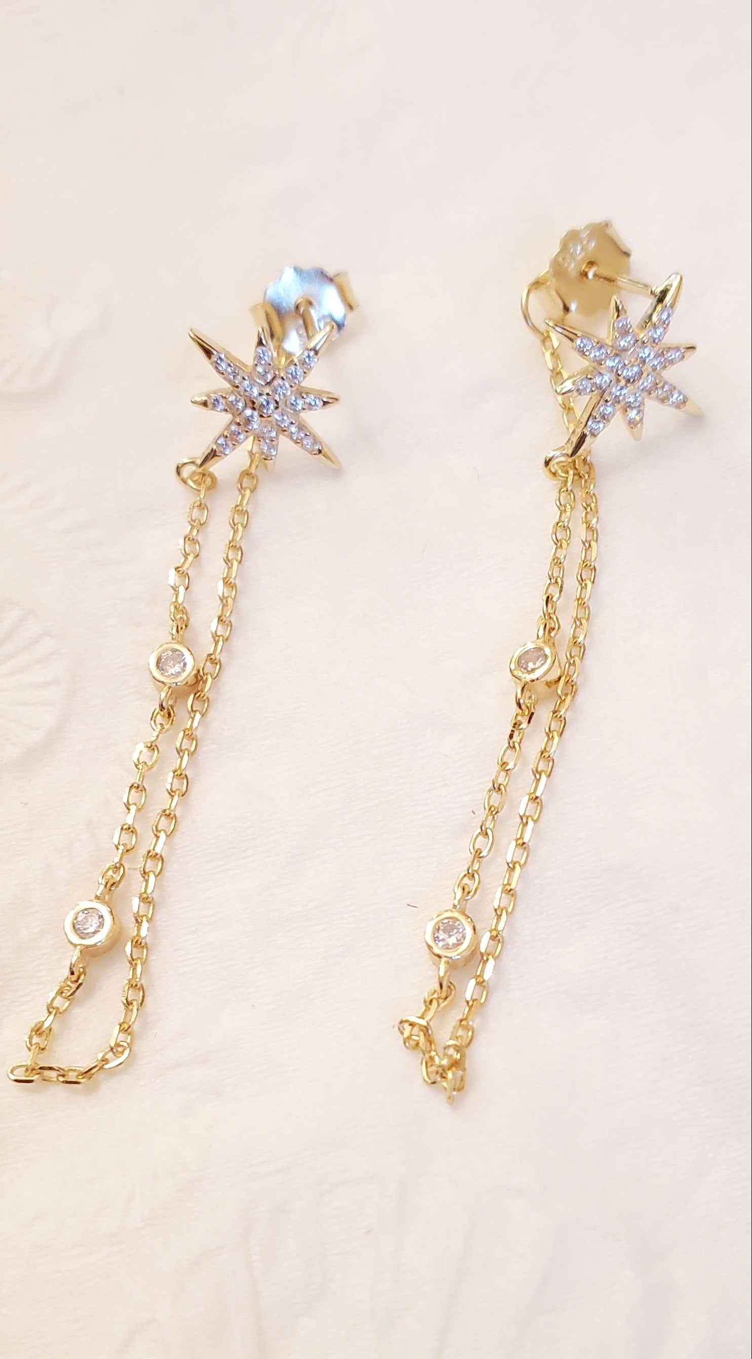 gold filled .925 sterling silver star earrings with dangling chain and 2 CZ stones.