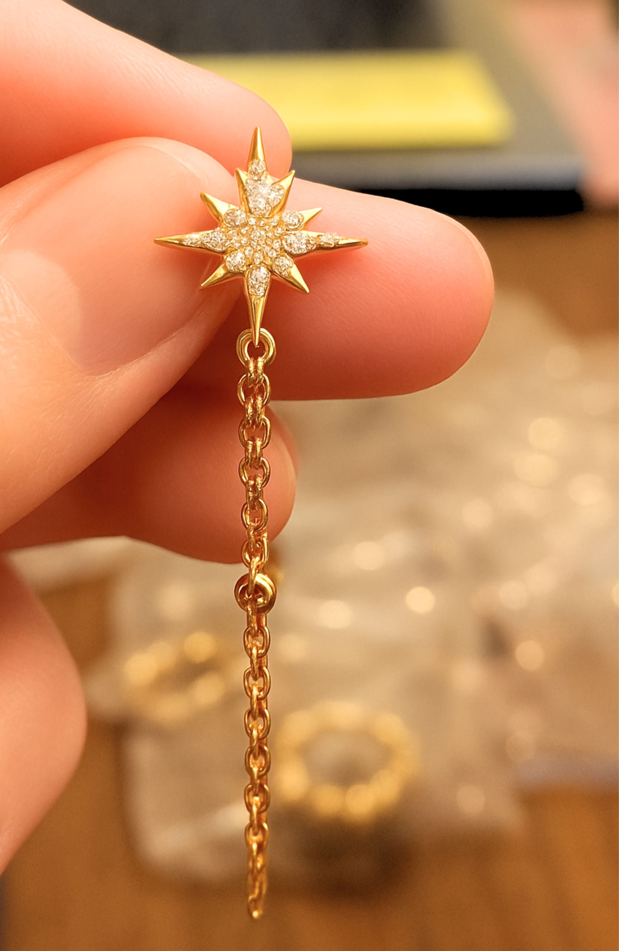 gold filled .925 sterling silver star earrings with dangling chain and 2 CZ stones.